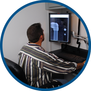 Technician Reviewing a Radiographic Image for Defects